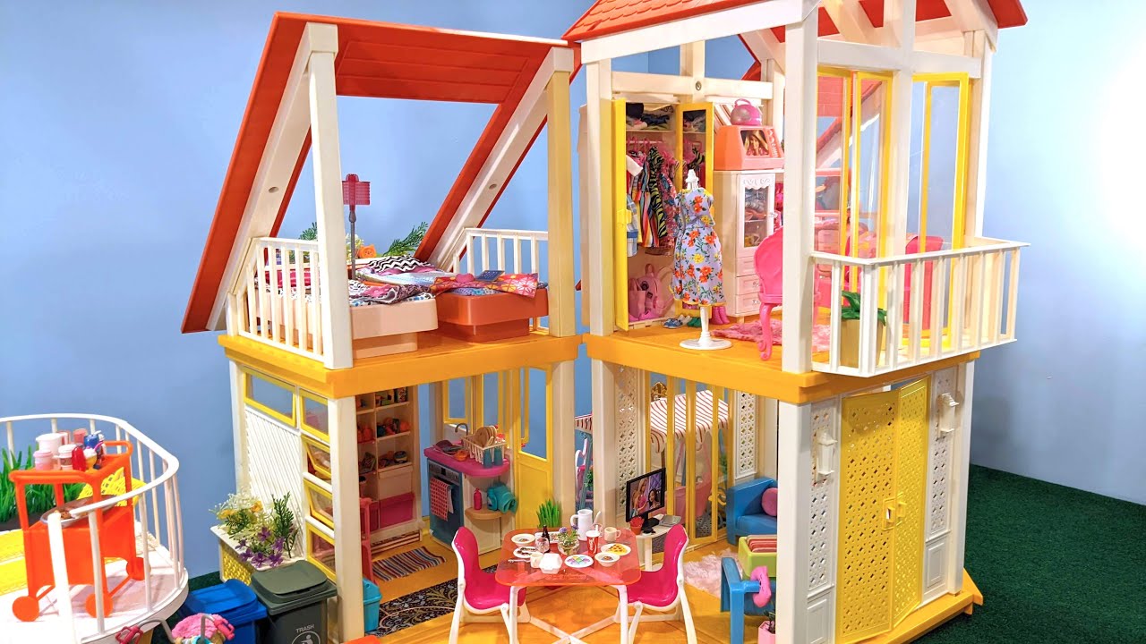 The Barbie Dreamhouse as it looked in the 1970s, with yellow and white walls and a colorful maximalist interior